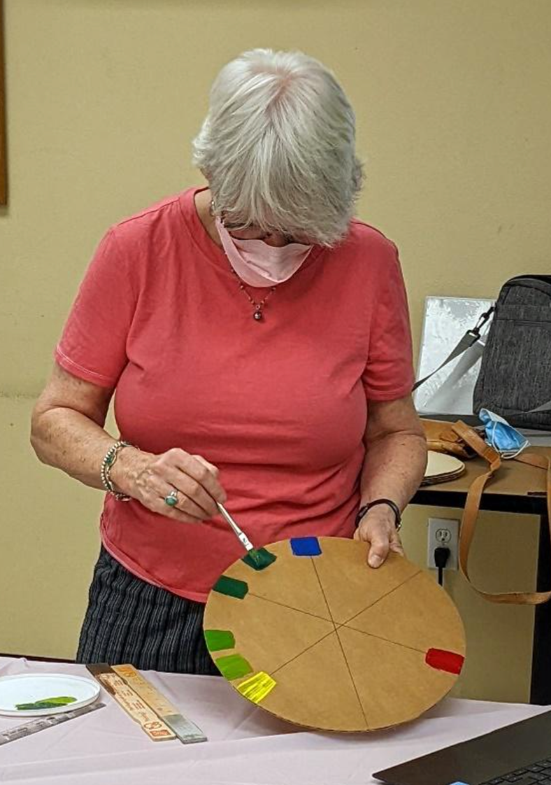 Instructor Ellen Dinerman demonstrating making a color wheel.