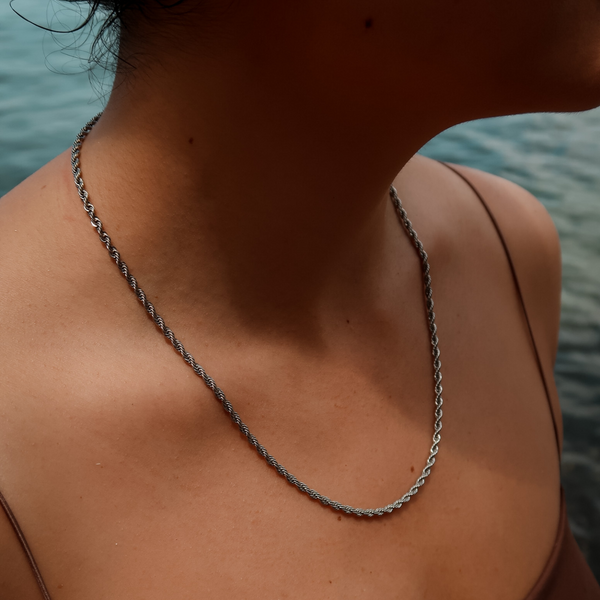 female wearing stainless steel rope chain