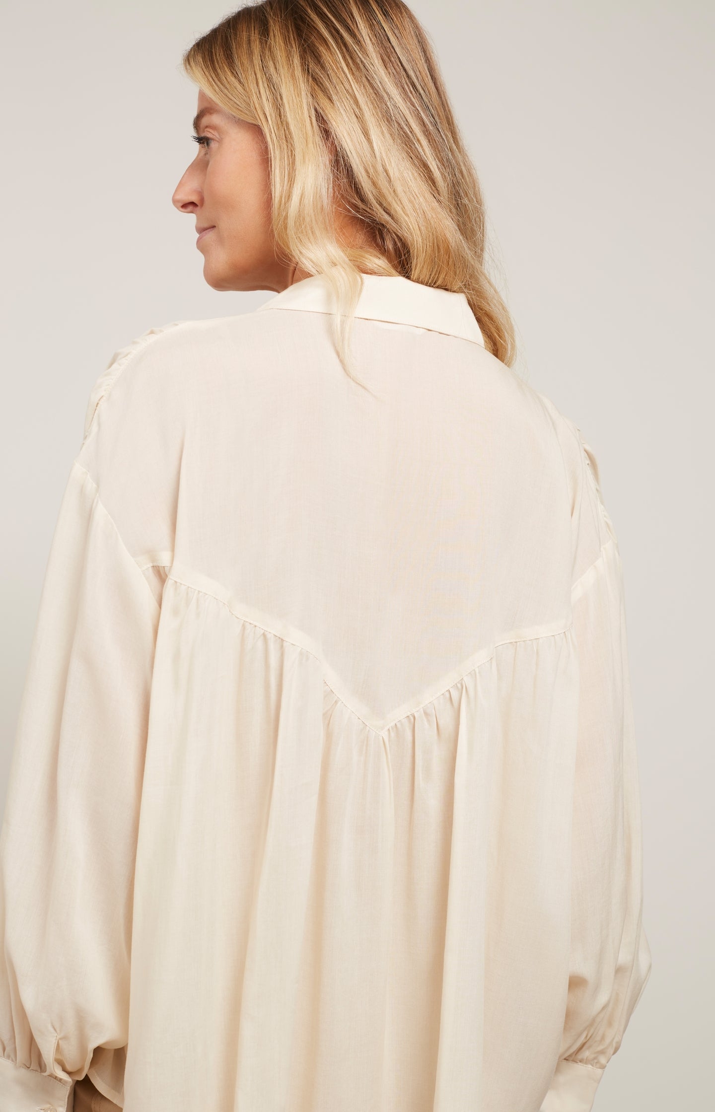 Blouse with long balloon sleeves, buttons and pleated detail