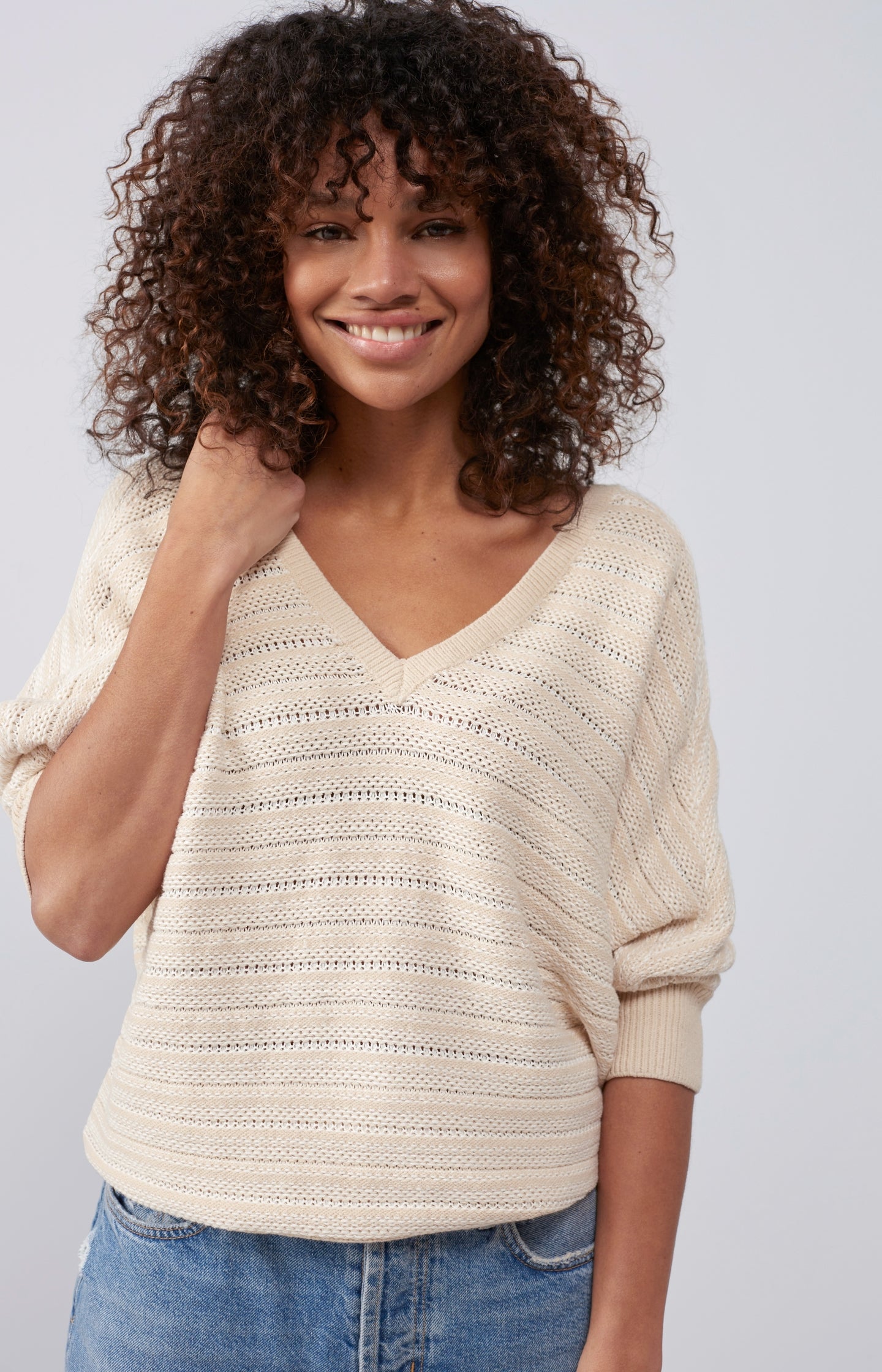 Double V-neck sweater with long sleeves and striped pattern