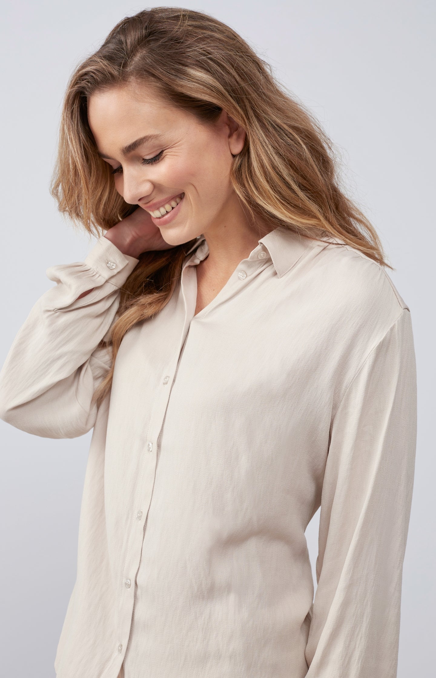 Flowy blouse with long balloon sleeves and pleated details