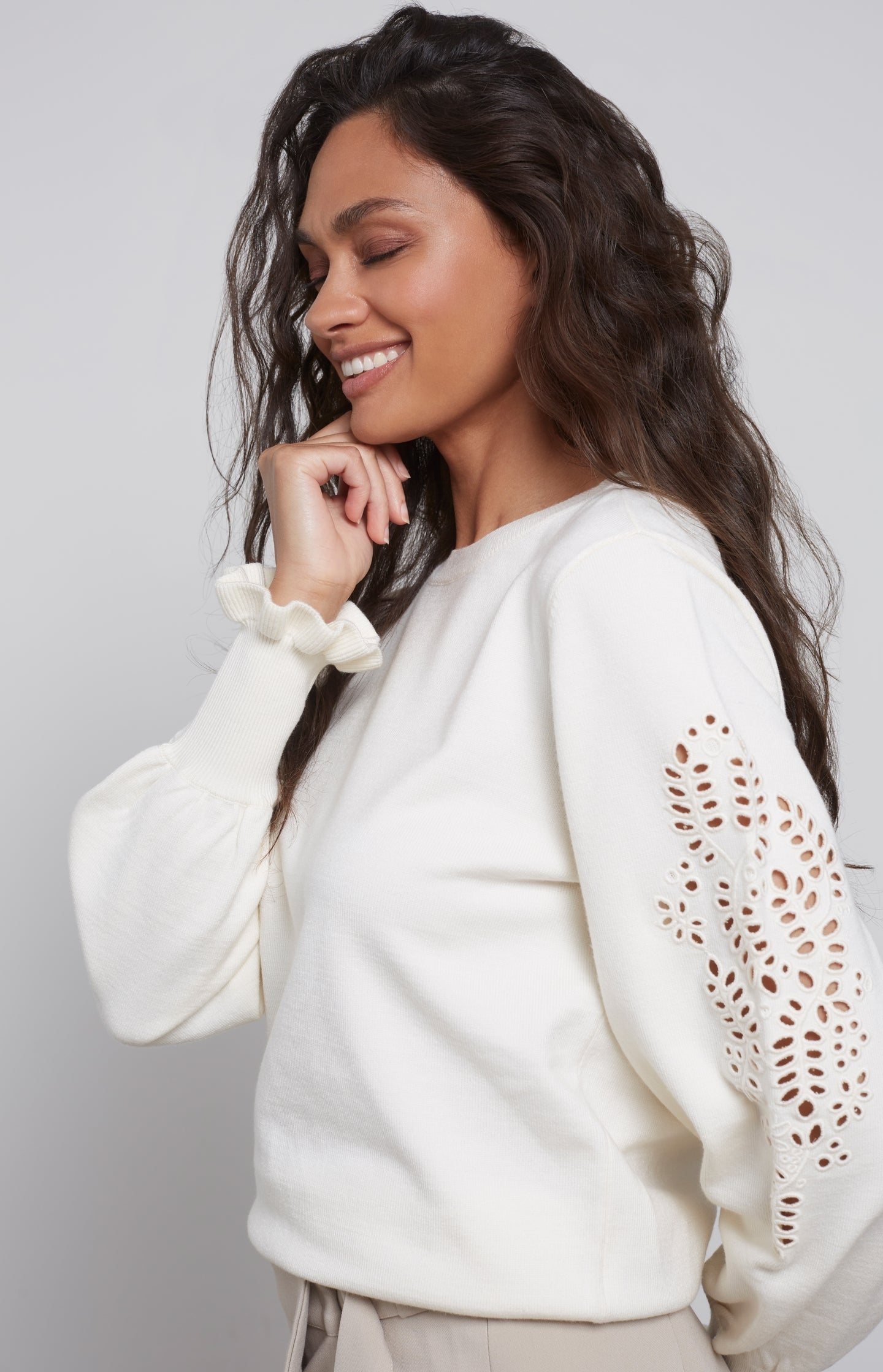 Laser cut sweater with round neck, long detailed puff sleeve