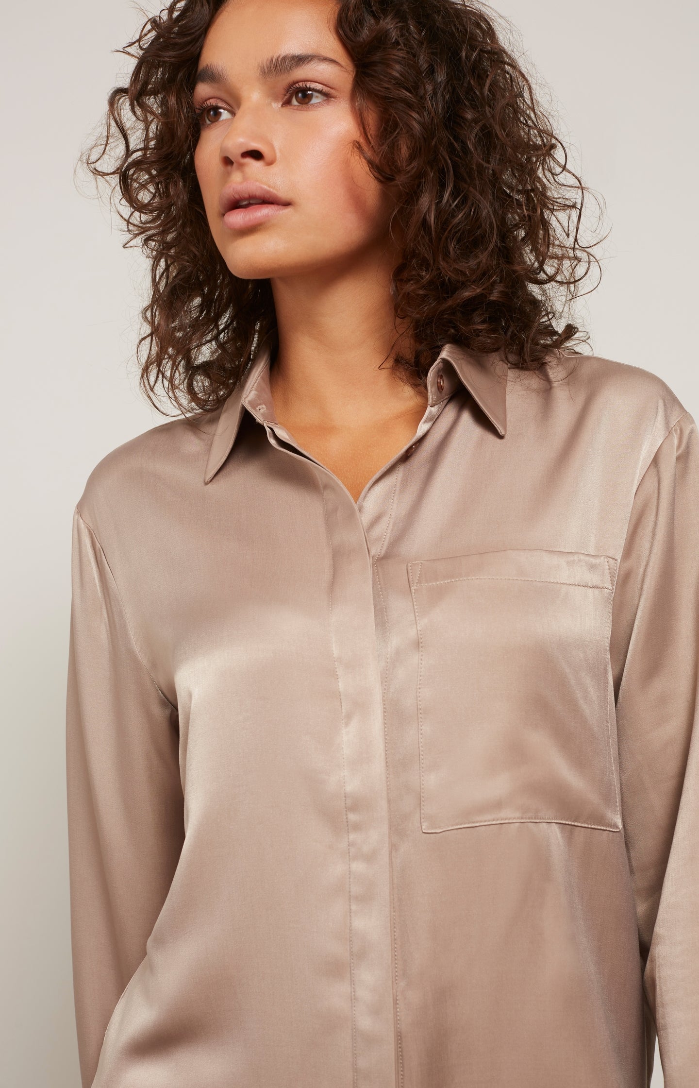 Satin blouse with long sleeves, pocket and button placket
