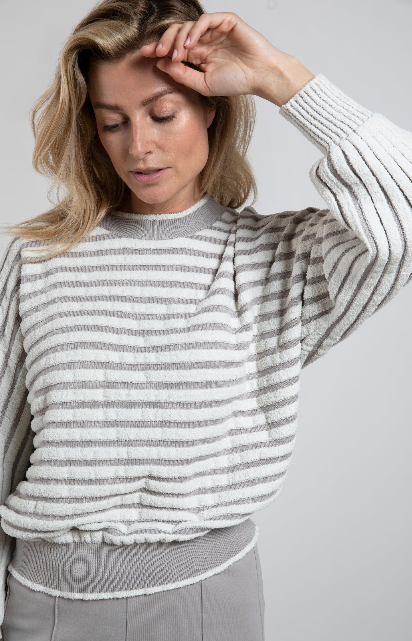 Striped sweater with crewneck, long sleeves and frayed seams