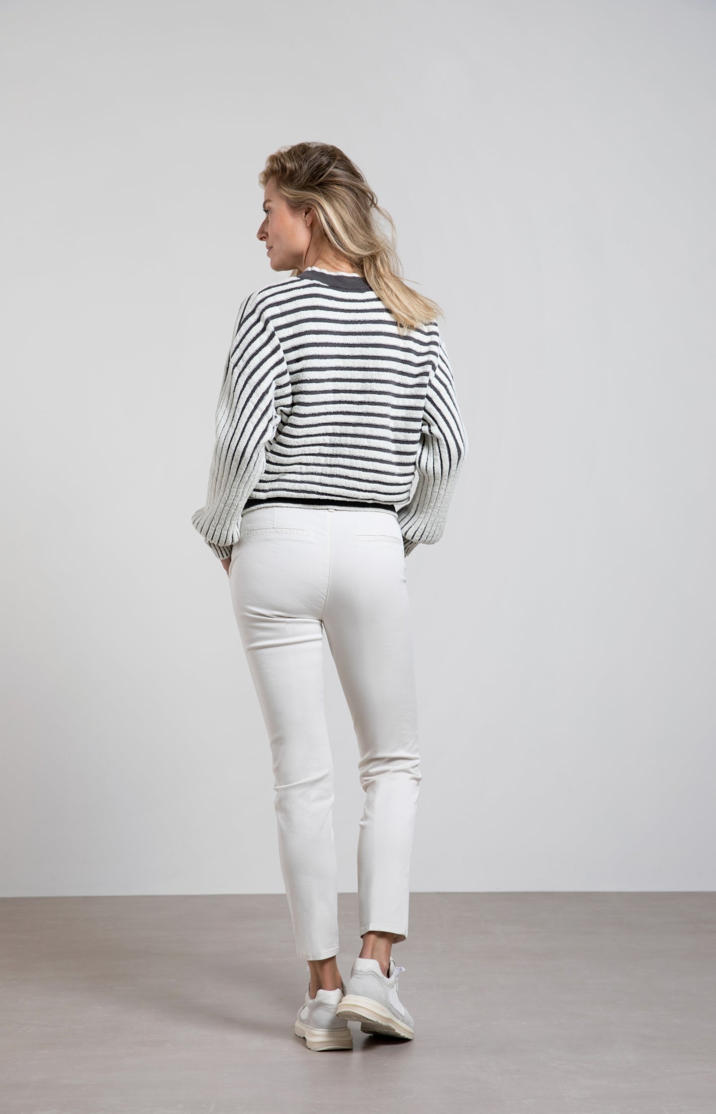 Striped sweater with crewneck, long sleeves and frayed seams