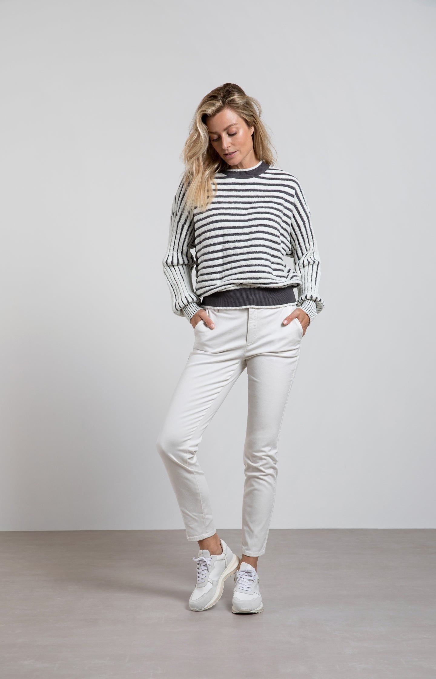 Striped sweater with crewneck, long sleeves and frayed seams