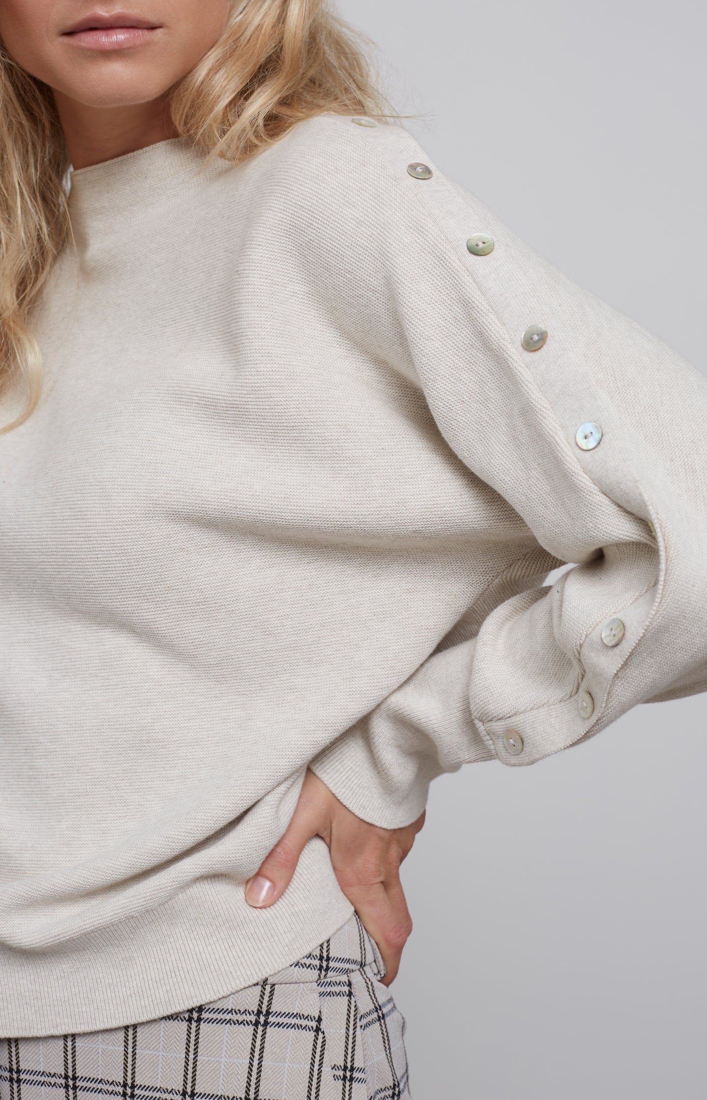 Sweater with round neck, long sleeves and buttons details