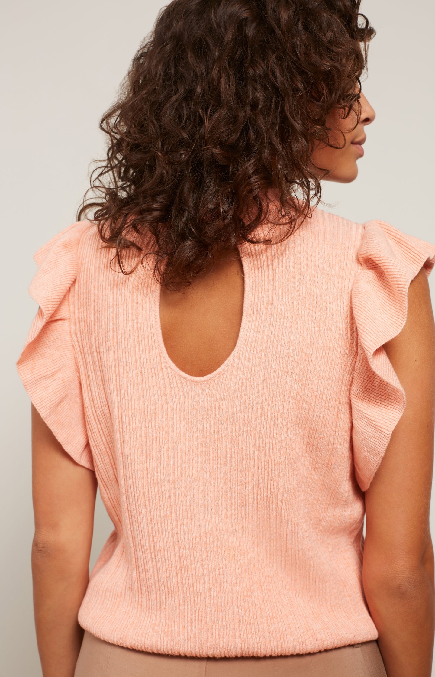 Sweater with round neck, ruffled cap sleeves and back detail