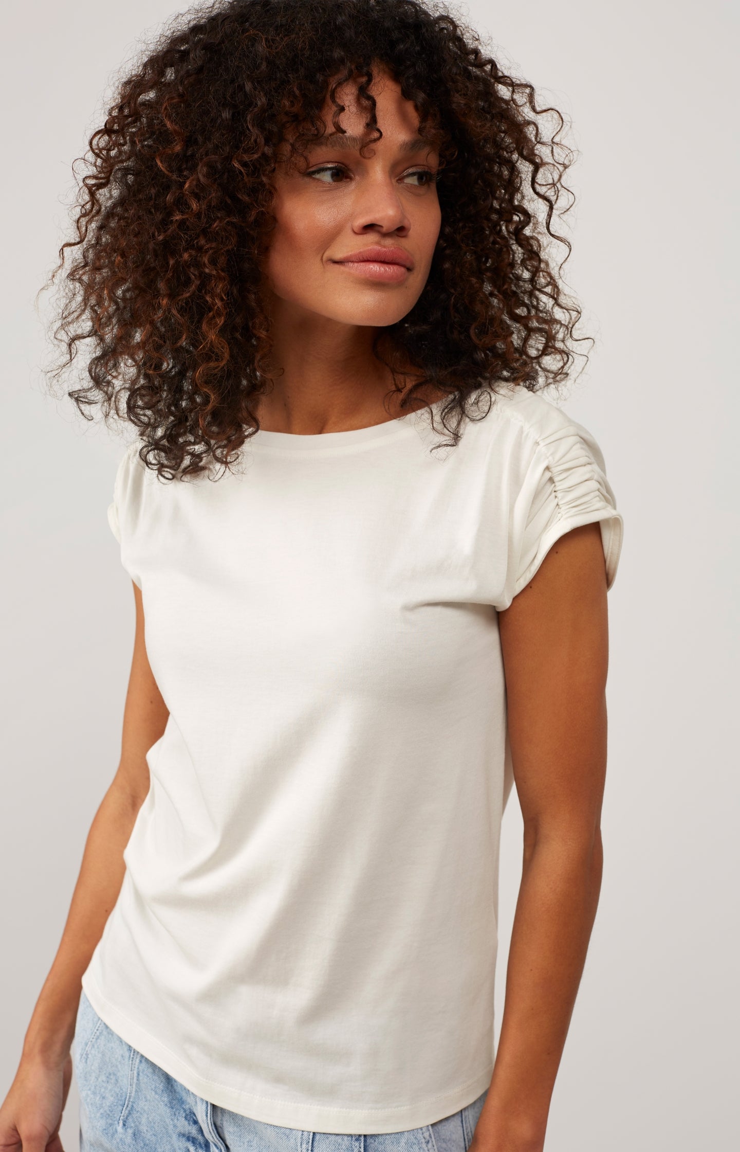 Top with boatneck, cap sleeves and shoulder details