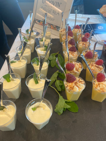 row of dessert puddings with fruit