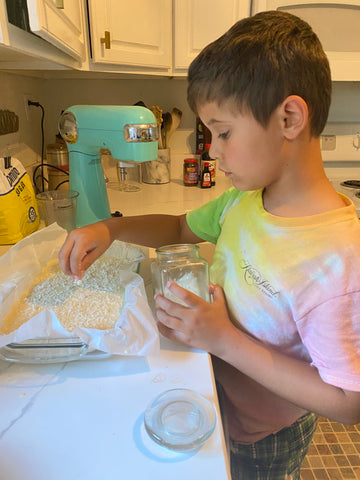 boy learning to cook