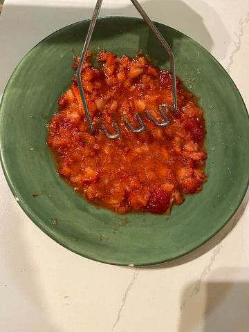 smashed strawberries on a plate