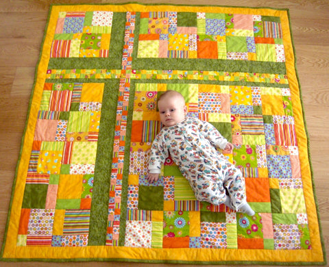 Baby on a quilt. First quilt for a firstborn child