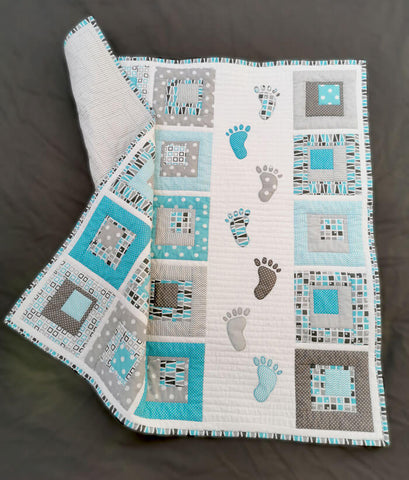 Blue Small Steps quilt for a baby boy