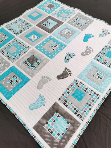 Baby quilt with baby footprints