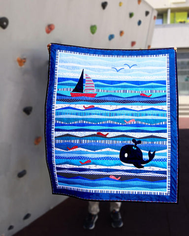 Blue ocean quilt for boys with waves, ship, whale and fishes