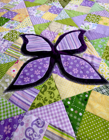Large butterfly appliqued on top of the "Butterflies in the Meadow" quilt