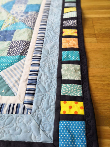 Scrappy border on the "Dragonfly in the Sky" baby quilt