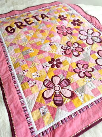 Baby girl quilt with flowers and girl's name "Blooming Meadow"