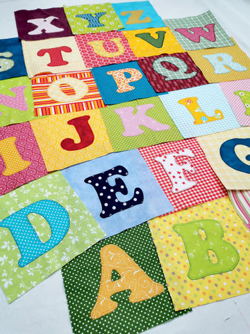 Letters appliqued on fabric