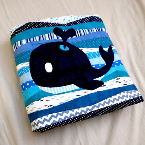 Cute whale appliqued on a baby quilt 