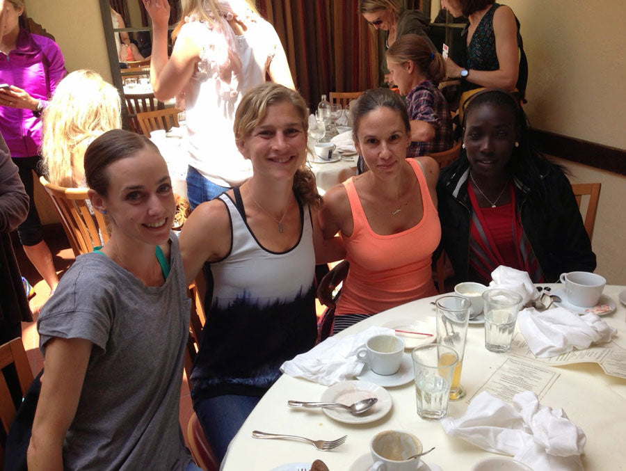 Molly Huddle, Lauren Fleshman, me, and Linet Masai at an NYRR lunch before the Mini 10K.