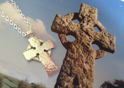 celtic cross pendant next to original carved stone celtic cross it was inspired by