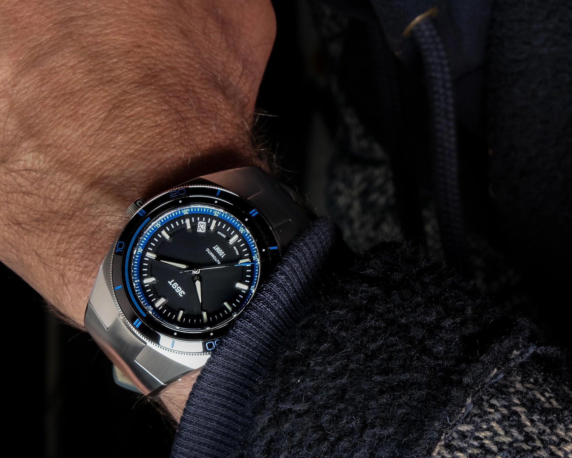 Very cool shot of the blue bezel watch on the wrist