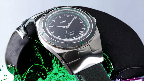 Beautiful shot of the 369 Green Bezel with splashes in the background 