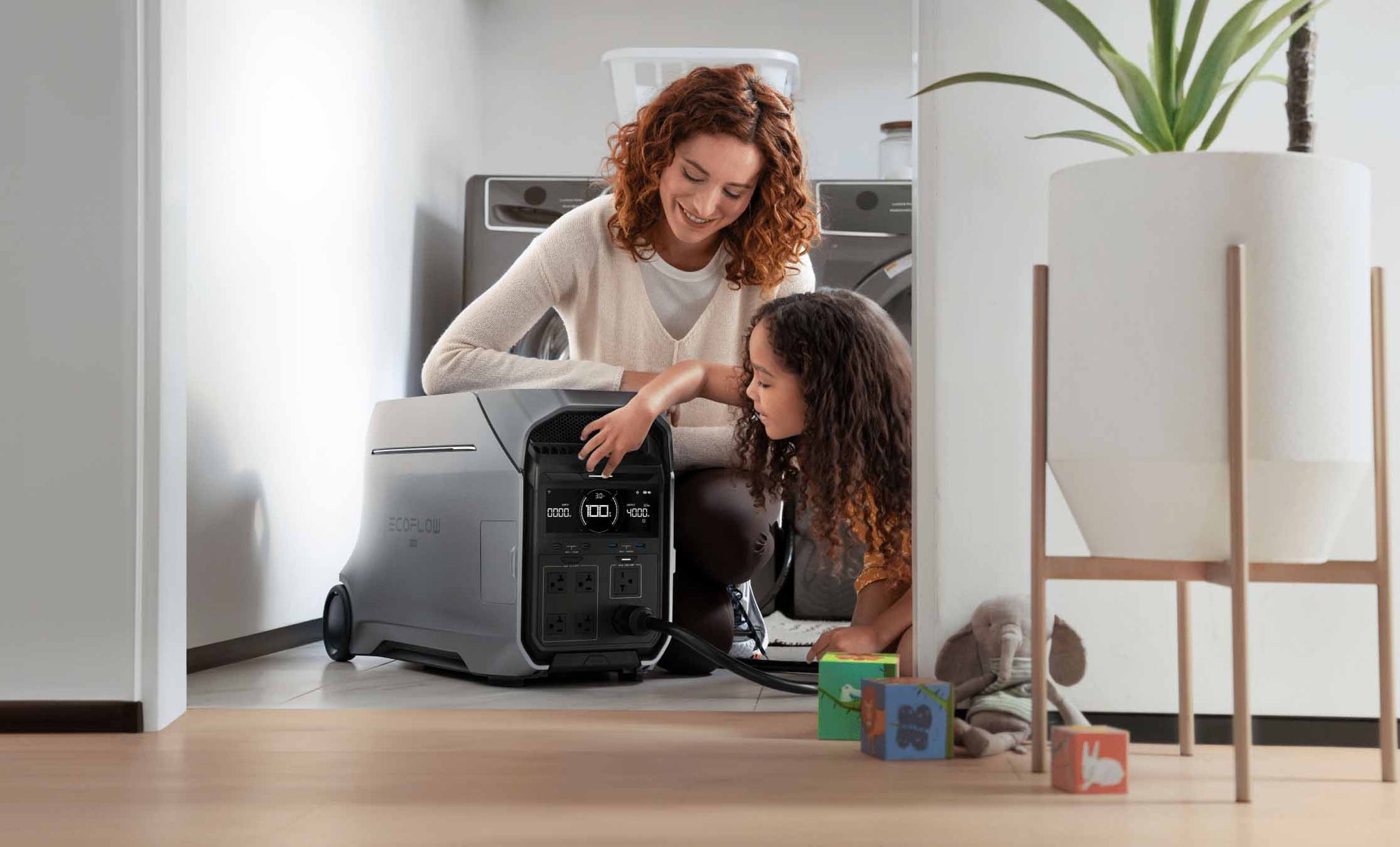 Mother And Child Sitting On The Floor In A Home With The DELTA Pro 3