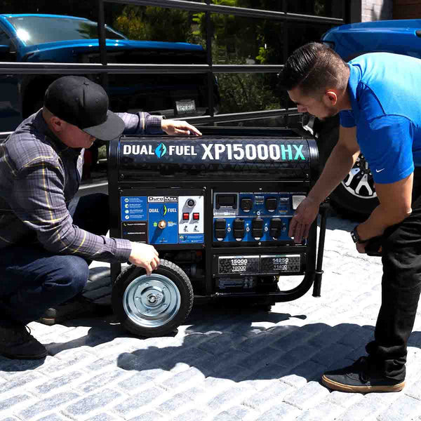 Two Men Discussing The DuroMaxXP15000-HX Outdoors On A Driveway