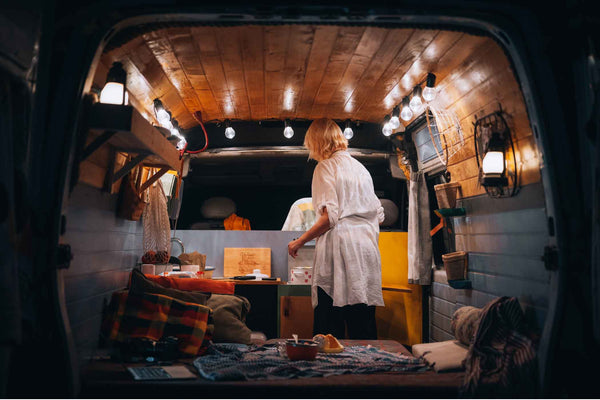 Woman In A Van At Night With Lights On