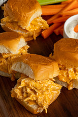 Chicken Sliders in a bun and served with carrots and dip