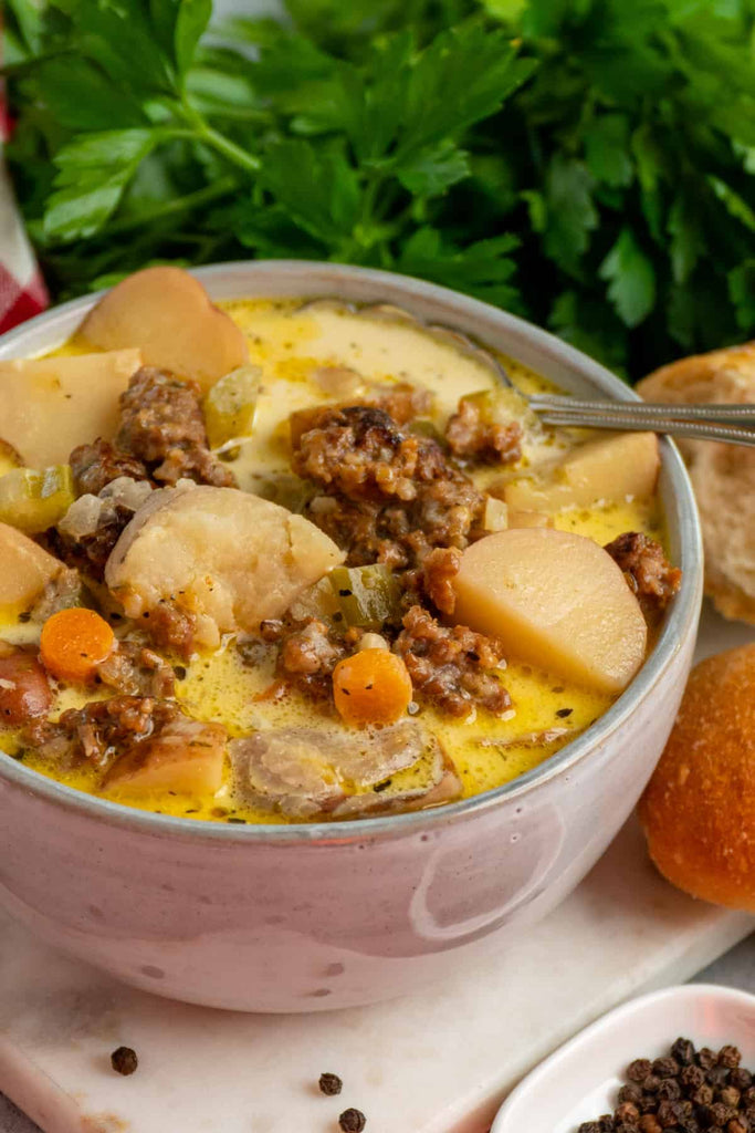 Crock Pot Sausage Potato Soup in a white bowl