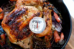 Roast Chicken with cooking thermometer to check inside temperature