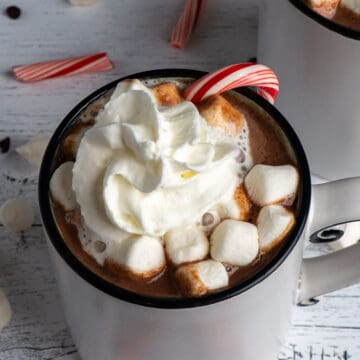 Hot Chocolate with a candy cane and marshmellows