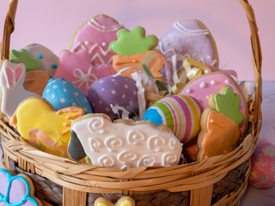 A basket with items for Easter like cookies