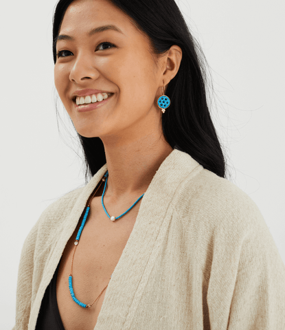 Model wearing Pearl And Turquoise Beaded Necklace