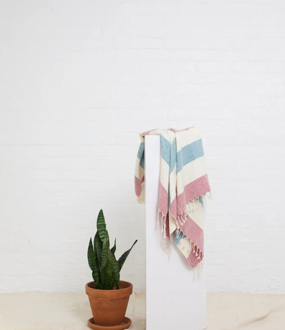 a stylish peshtemal towel in the stripe print in colours pink, white and blue