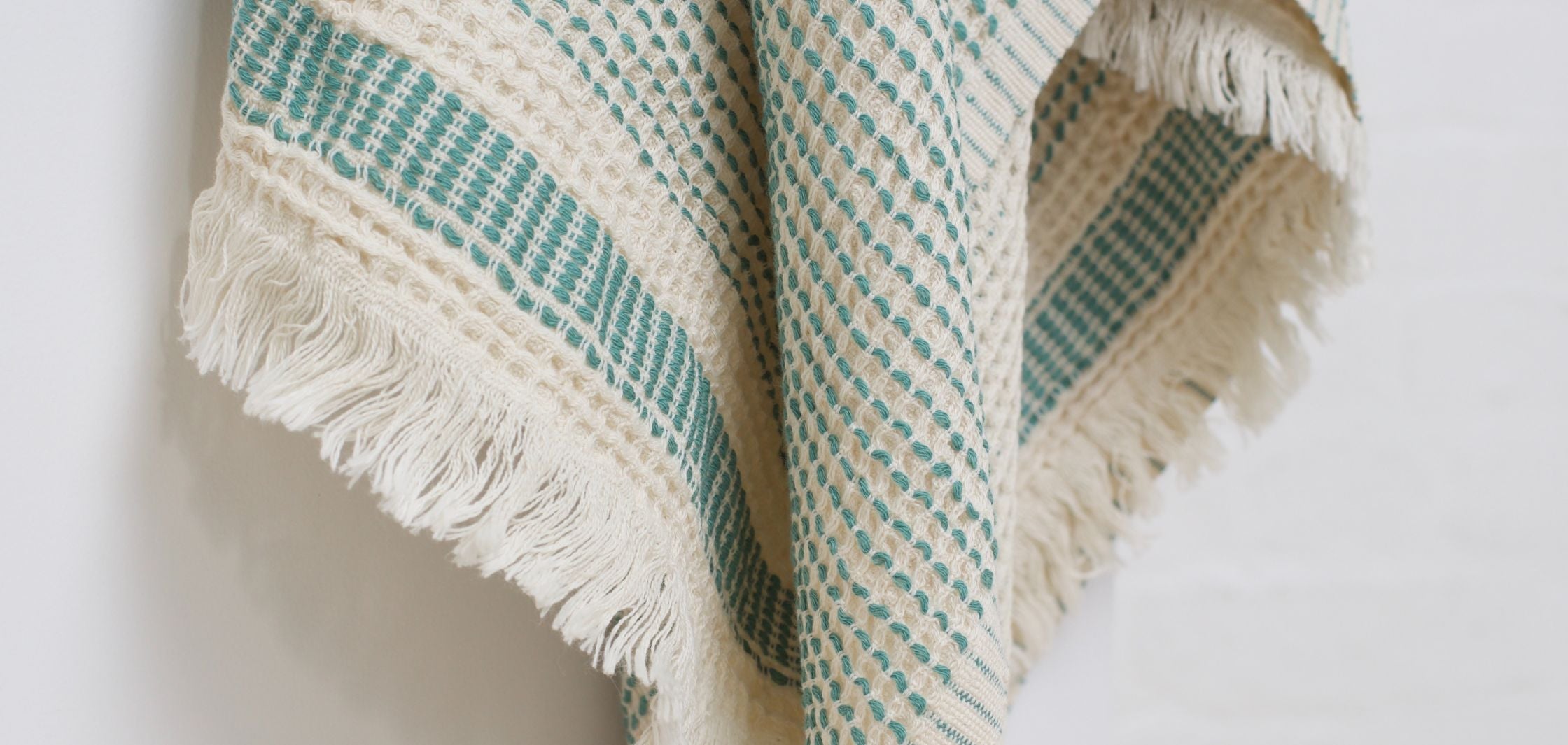 Kalkan Beach Towel displayed in three vibrant colors-sage green, chocolate brown, mustard, and copper