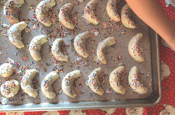Icing and sprinkles on Cuccidati cookies