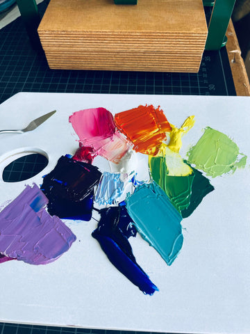 a palette of different colors for linocut printing