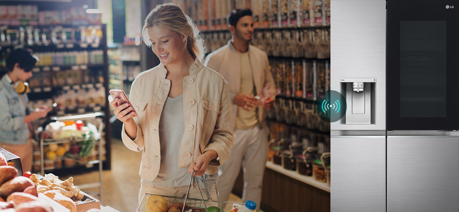 The image on the left shows a woman standing in a grocery store looking at her phone. The image on the right shows the front view of the refrigerator. In the center of the images is an icon to show the connectivity between the phone and the refrigerator.