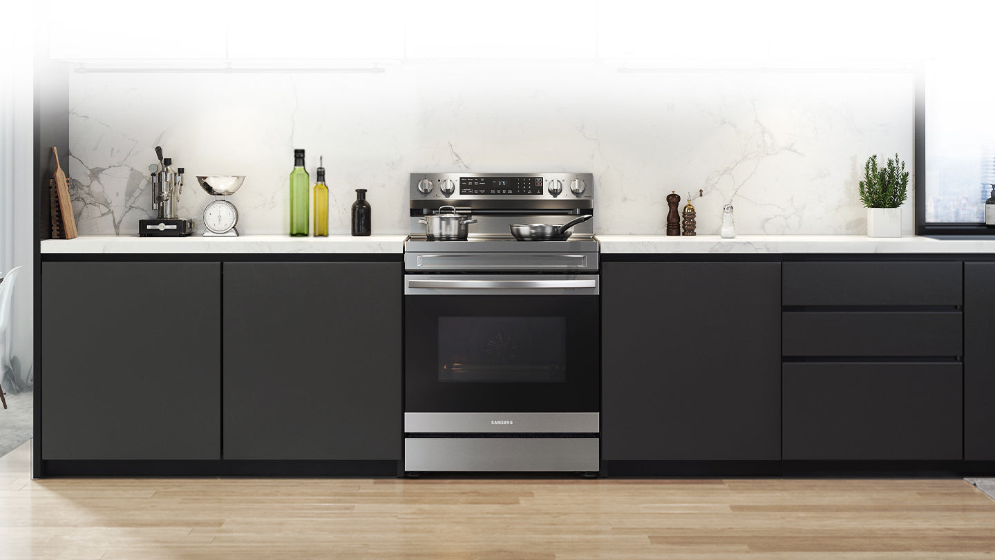 Shows a modern kitchen with the stylish, stainless steel oven fitting neatly into the design.