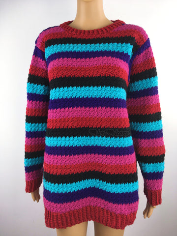 A striped crocheted jumper in burgundy, black, dark pink, turquoise and purple