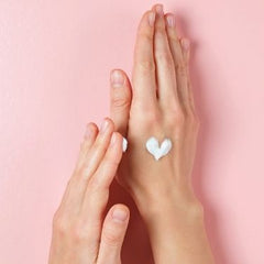 women hands with moisturizing cream