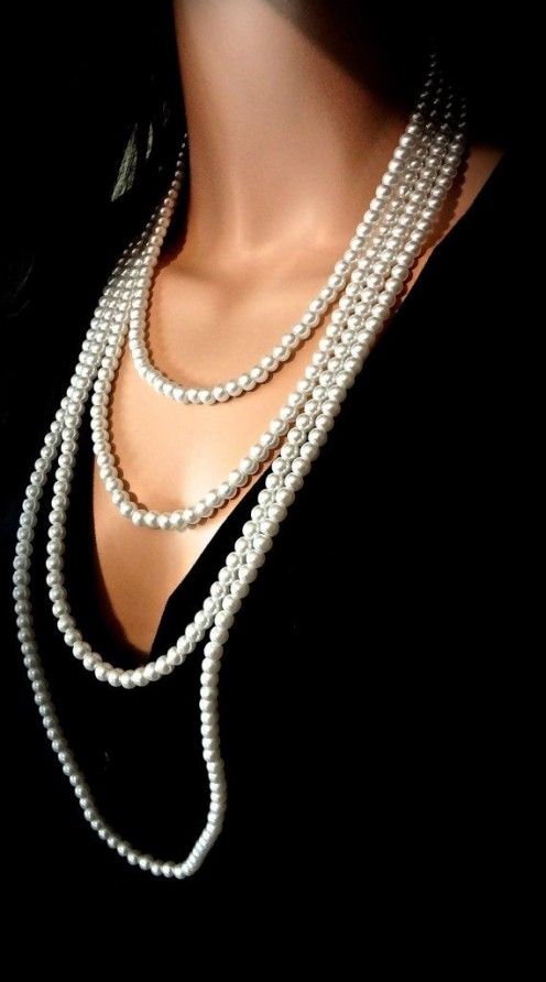 black dress: layered necklace