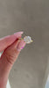 Nekija - 4 Claw Round Solitaire with Accent Stones Lifestyle Image
