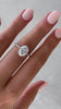 Penelope  – Oval Solitaire with Hidden Halo and Triple Pavé Lifestyle Image