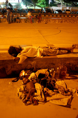 Homeless Child on Street with Parent, Courtesy Wikimedia